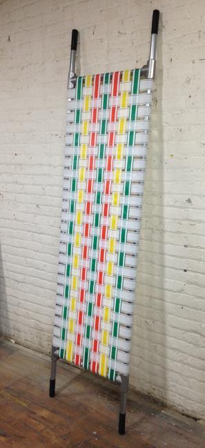 Mike Simi, Stretcher, 2014, aluminum, nylon webbing and rubber, 92 x 25 inches. 