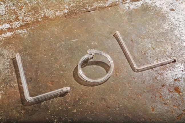 Dylan Neuwirth, LOL Crackpipes, 2013, blown glass, wood, hardware, 13 x 26 inches overall, edition of 5. 